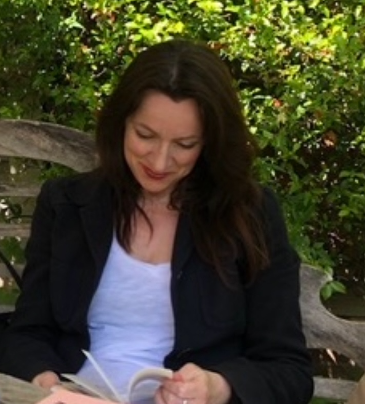 Annemarie Lopez reading outdoors